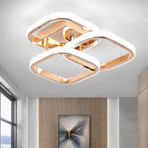 Modern ceiling light fixture in a room with a painting on the wall.